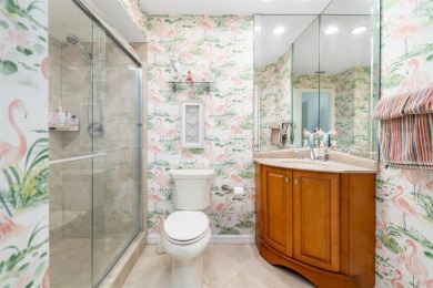 This expansive villa offers the space and comfort of a private on Longboat Key Golf Club Resort in Florida - for sale on GolfHomes.com, golf home, golf lot