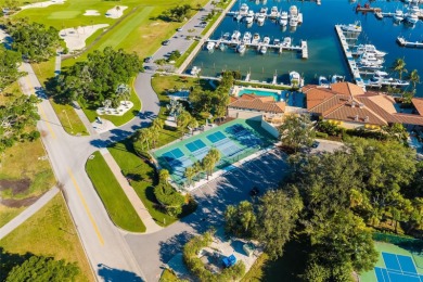 This expansive villa offers the space and comfort of a private on Longboat Key Golf Club Resort in Florida - for sale on GolfHomes.com, golf home, golf lot