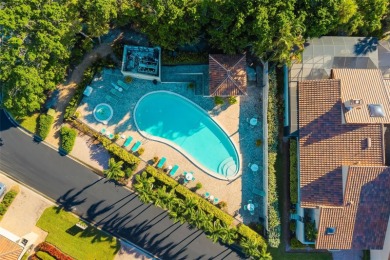 This expansive villa offers the space and comfort of a private on Longboat Key Golf Club Resort in Florida - for sale on GolfHomes.com, golf home, golf lot