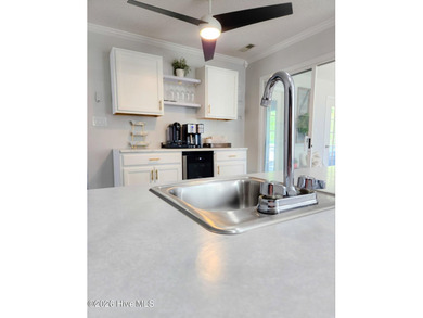 Step into a home that truly hits it out of the park, offering on Harbour Point Golf Club in North Carolina - for sale on GolfHomes.com, golf home, golf lot