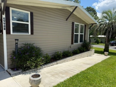This magnificent double-wide mobile home in the desirable on Rolling Greens Executive Golf Community in Florida - for sale on GolfHomes.com, golf home, golf lot