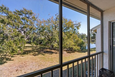 Relax and enjoy the serene views from your screened on East Lake Woodlands Country Club in Florida - for sale on GolfHomes.com, golf home, golf lot
