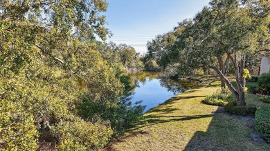 Relax and enjoy the serene views from your screened on East Lake Woodlands Country Club in Florida - for sale on GolfHomes.com, golf home, golf lot