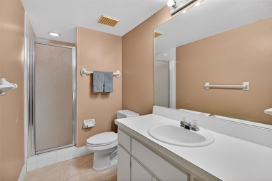 Relax and enjoy the serene views from your screened on East Lake Woodlands Country Club in Florida - for sale on GolfHomes.com, golf home, golf lot