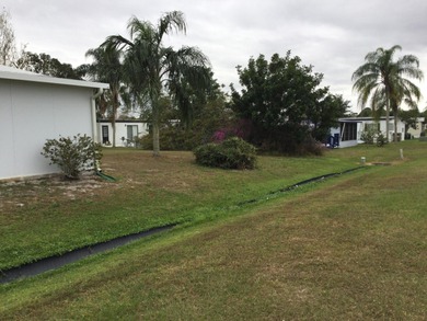 Meticulously restored home with state of the art kitchen.  This on Spanish Lakes I in Florida - for sale on GolfHomes.com, golf home, golf lot
