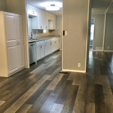 Meticulously restored home with state of the art kitchen.  This on Spanish Lakes I in Florida - for sale on GolfHomes.com, golf home, golf lot