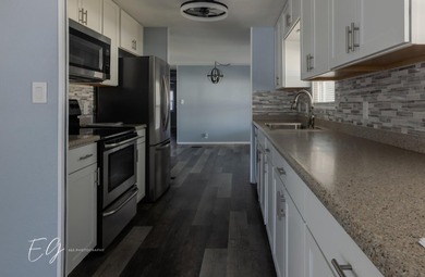 Meticulously restored home with state of the art kitchen. This on Spanish Lakes I in Florida - for sale on GolfHomes.com, golf home, golf lot