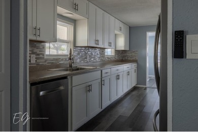 Meticulously restored home with state of the art kitchen. This on Spanish Lakes I in Florida - for sale on GolfHomes.com, golf home, golf lot