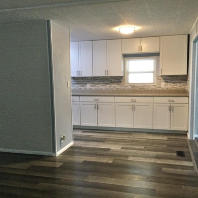 Meticulously restored home with state of the art kitchen.  This on Spanish Lakes I in Florida - for sale on GolfHomes.com, golf home, golf lot