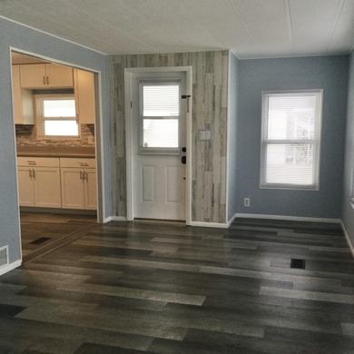 Meticulously restored home with state of the art kitchen.  This on Spanish Lakes I in Florida - for sale on GolfHomes.com, golf home, golf lot