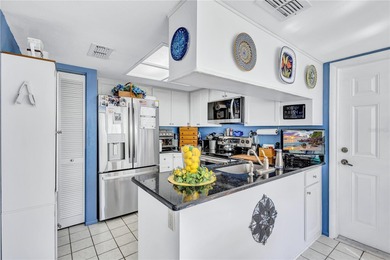 Welcome to this stunning two bedroom two bath villa nestled in a on Highland Lakes Executive Golf Course in Florida - for sale on GolfHomes.com, golf home, golf lot