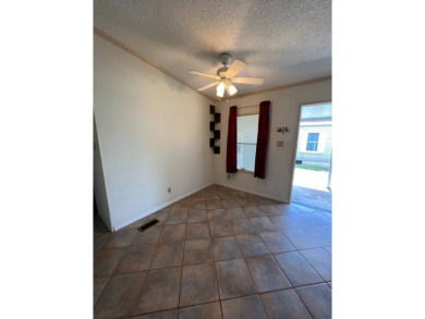 2 bed | 2 bath | 864 sq ft - Handyman's Special in Highly on Lake Henry Golf Club in Florida - for sale on GolfHomes.com, golf home, golf lot