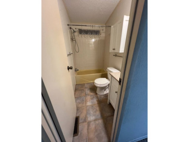 2 bed | 2 bath | 864 sq ft - Handyman's Special in Highly on Lake Henry Golf Club in Florida - for sale on GolfHomes.com, golf home, golf lot