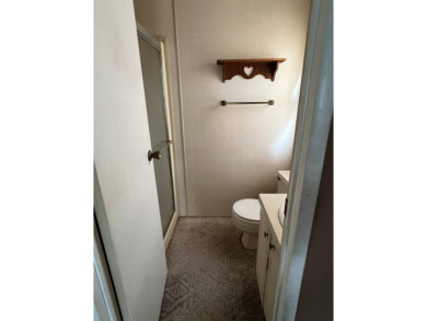 2 bed | 2 bath | 864 sq ft - Handyman's Special in Highly on Lake Henry Golf Club in Florida - for sale on GolfHomes.com, golf home, golf lot