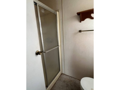 2 bed | 2 bath | 864 sq ft - Handyman's Special in Highly on Lake Henry Golf Club in Florida - for sale on GolfHomes.com, golf home, golf lot