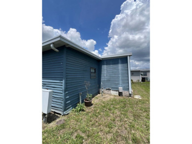 2 bed | 2 bath | 864 sq ft - Handyman's Special in Highly on Lake Henry Golf Club in Florida - for sale on GolfHomes.com, golf home, golf lot