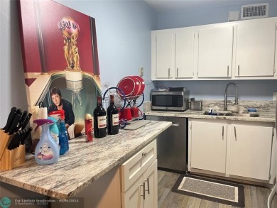 OK TO FINANCE IN THIS BUILDING *****SECOND FLOOR  UNIT. There is on Hillsboro Pines Golf in Florida - for sale on GolfHomes.com, golf home, golf lot