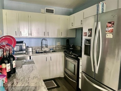 OK TO FINANCE IN THIS BUILDING *****SECOND FLOOR  UNIT. There is on Hillsboro Pines Golf in Florida - for sale on GolfHomes.com, golf home, golf lot