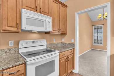 Welcome to 501 Sandpiper Bay SW, a beautifully maintained on Sandpiper Bay Golf and Country Club in North Carolina - for sale on GolfHomes.com, golf home, golf lot