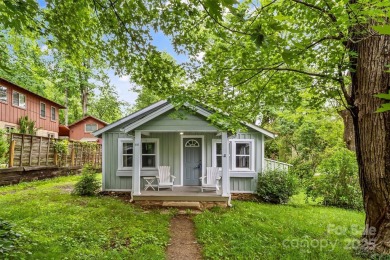 Views of Lake Tomahawk! This charming 2-bedroom/1-bath cottage on Black Mountain Golf Course in North Carolina - for sale on GolfHomes.com, golf home, golf lot