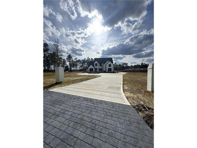 Welcome to 20 Club Drive in Jesup, a stunning luxury residence on Pine Forest Country Club in Georgia - for sale on GolfHomes.com, golf home, golf lot