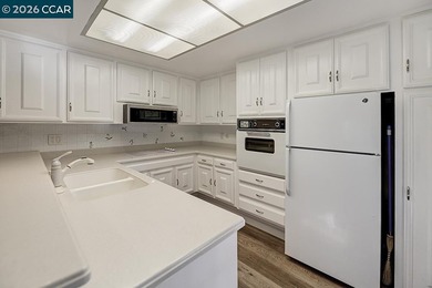 This reconfigured end unit Carmel features two bedrooms and two on Rossmoor Golf Course in California - for sale on GolfHomes.com, golf home, golf lot