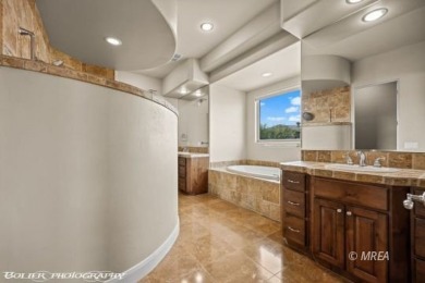 Envelop yourself in luxury. Located in the beautiful gated on Falcon Ridge Golf Course in Nevada - for sale on GolfHomes.com, golf home, golf lot