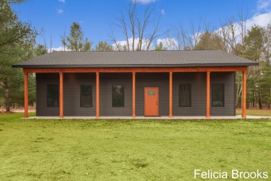 Welcome home to this recently completed bardominium style home - on Tullymore Golf Club in Michigan - for sale on GolfHomes.com, golf home, golf lot