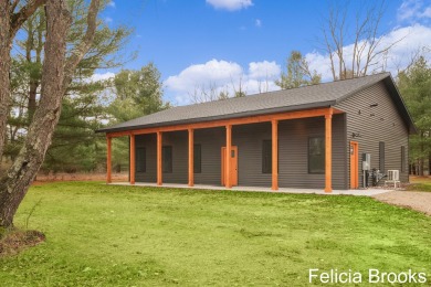 Welcome home to this recently completed bardominium style home - on Tullymore Golf Club in Michigan - for sale on GolfHomes.com, golf home, golf lot