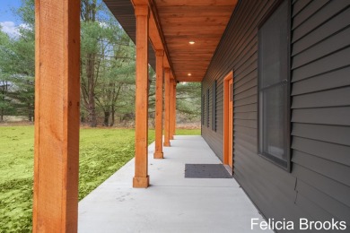 Welcome home to this recently completed bardominium style home - on Tullymore Golf Club in Michigan - for sale on GolfHomes.com, golf home, golf lot