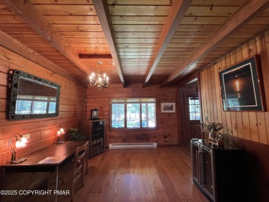 Immaculate Log Cabin in Pocono Farms Country Club Association - on Pocono Farms Country Club in Pennsylvania - for sale on GolfHomes.com, golf home, golf lot