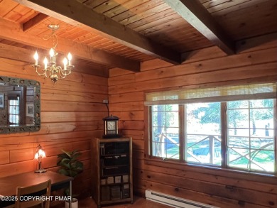 Immaculate Log Cabin in Pocono Farms Country Club Association - on Pocono Farms Country Club in Pennsylvania - for sale on GolfHomes.com, golf home, golf lot