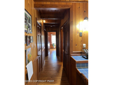 Immaculate Log Cabin in Pocono Farms Country Club Association - on Pocono Farms Country Club in Pennsylvania - for sale on GolfHomes.com, golf home, golf lot