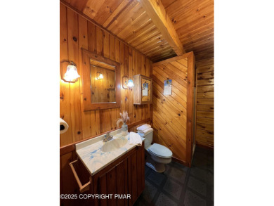 Immaculate Log Cabin in Pocono Farms Country Club Association - on Pocono Farms Country Club in Pennsylvania - for sale on GolfHomes.com, golf home, golf lot