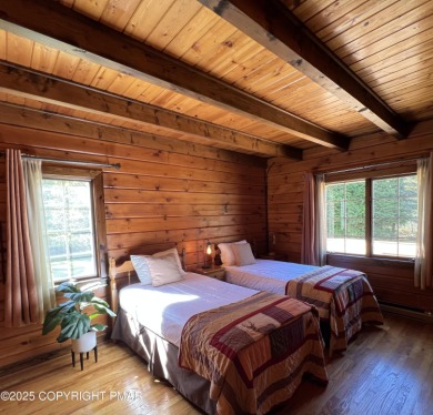 Immaculate Log Cabin in Pocono Farms Country Club Association - on Pocono Farms Country Club in Pennsylvania - for sale on GolfHomes.com, golf home, golf lot