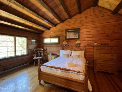 Immaculate Log Cabin in Pocono Farms Country Club Association - on Pocono Farms Country Club in Pennsylvania - for sale on GolfHomes.com, golf home, golf lot