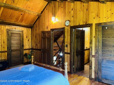 Immaculate Log Cabin in Pocono Farms Country Club Association - on Pocono Farms Country Club in Pennsylvania - for sale on GolfHomes.com, golf home, golf lot