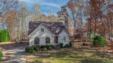 This all-brick home, nestled on just under an acre overlooks on Plantation Golf Club in North Carolina - for sale on GolfHomes.com, golf home, golf lot