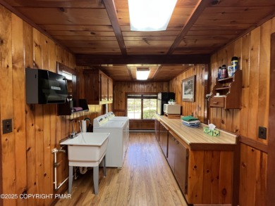 Immaculate Log Cabin in Pocono Farms Country Club Association - on Pocono Farms Country Club in Pennsylvania - for sale on GolfHomes.com, golf home, golf lot