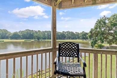 Expansive golf and water views abound in this spacious condo on Oyster Bay Golf Links in North Carolina - for sale on GolfHomes.com, golf home, golf lot
