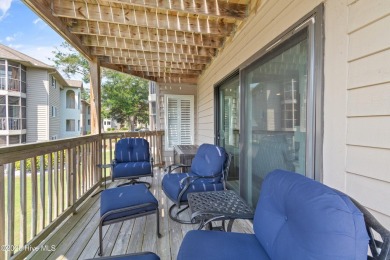 Expansive golf and water views abound in this spacious condo on Oyster Bay Golf Links in North Carolina - for sale on GolfHomes.com, golf home, golf lot