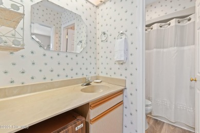 Expansive golf and water views abound in this spacious condo on Oyster Bay Golf Links in North Carolina - for sale on GolfHomes.com, golf home, golf lot