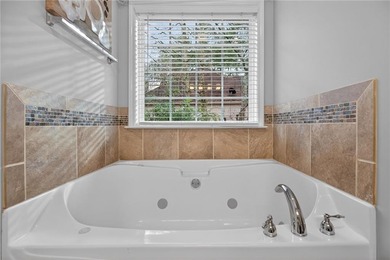 Tucked inside the gated, resort-style community of Fairfield on Fairfield Plantation Golf and Country Club in Georgia - for sale on GolfHomes.com, golf home, golf lot