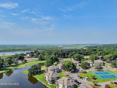 Expansive golf and water views abound in this spacious condo on Oyster Bay Golf Links in North Carolina - for sale on GolfHomes.com, golf home, golf lot