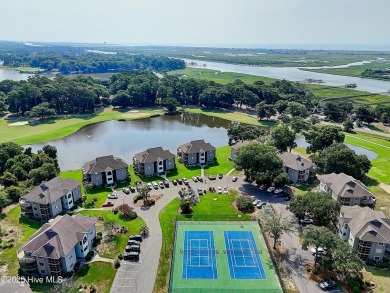Expansive golf and water views abound in this spacious condo on Oyster Bay Golf Links in North Carolina - for sale on GolfHomes.com, golf home, golf lot