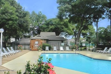 Expansive golf and water views abound in this spacious condo on Oyster Bay Golf Links in North Carolina - for sale on GolfHomes.com, golf home, golf lot