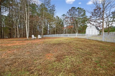 Tucked inside the gated, resort-style community of Fairfield on Fairfield Plantation Golf and Country Club in Georgia - for sale on GolfHomes.com, golf home, golf lot
