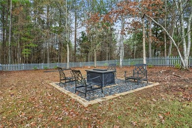 Tucked inside the gated, resort-style community of Fairfield on Fairfield Plantation Golf and Country Club in Georgia - for sale on GolfHomes.com, golf home, golf lot