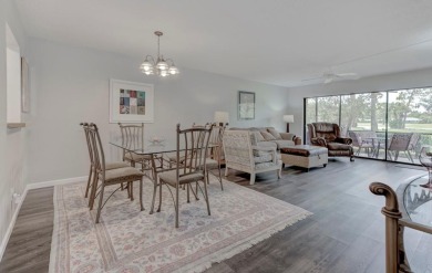 Rare First-Floor 3-Bedroom Corner Condo with Golf Course Views - on University Park Country Club in Florida - for sale on GolfHomes.com, golf home, golf lot
