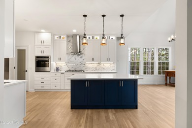 Prepared to be wowed by this custom William Poole designed home on Members Club At St. James Plantation in North Carolina - for sale on GolfHomes.com, golf home, golf lot